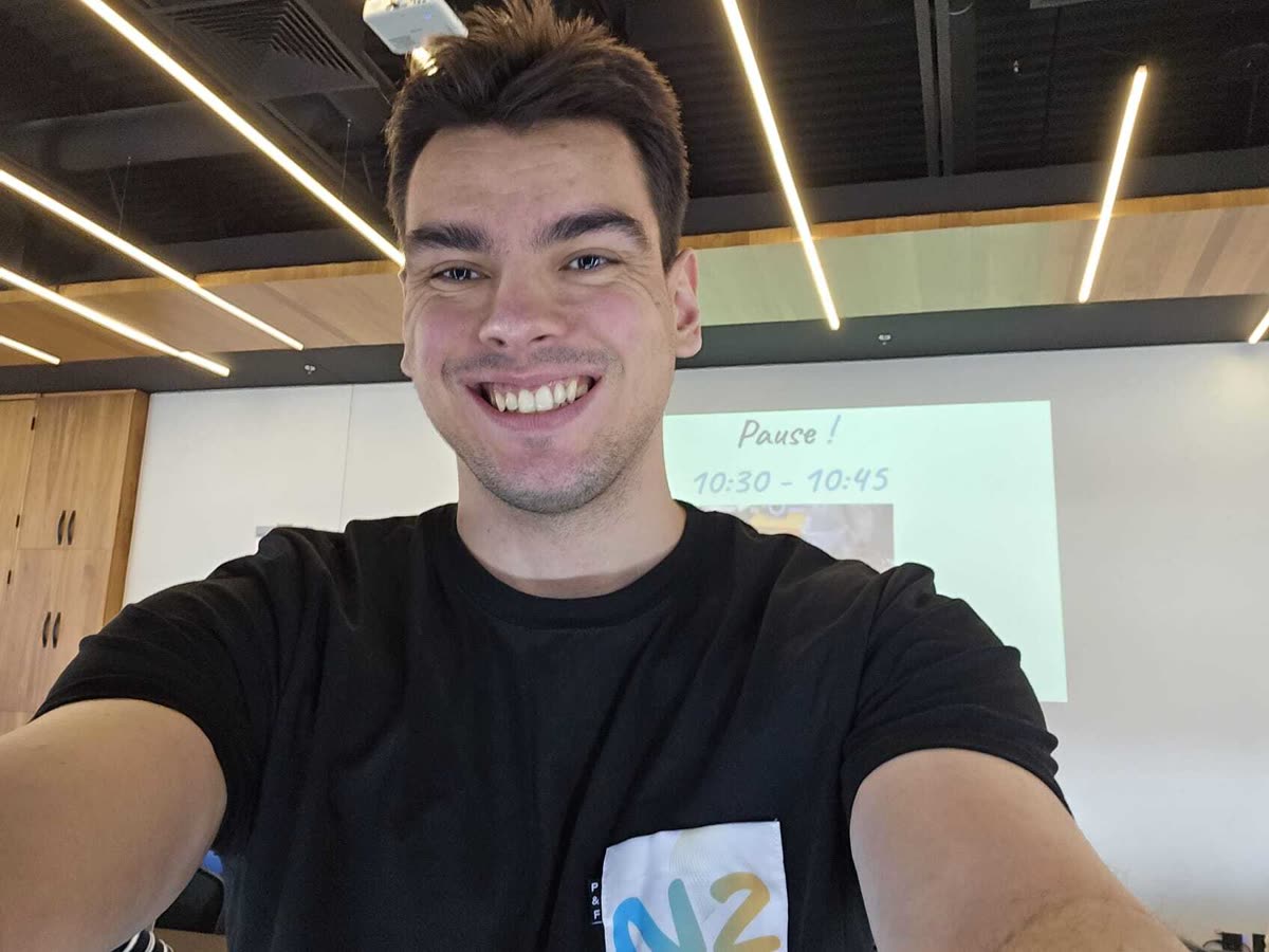 Jonathan Andrei smiling at a developer workshop