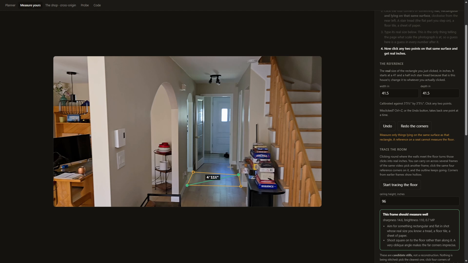 Four clicked corners on a photograph of the basement floor, and every subsequent click lands in real inches on the plane. One photograph, no reconstruction.